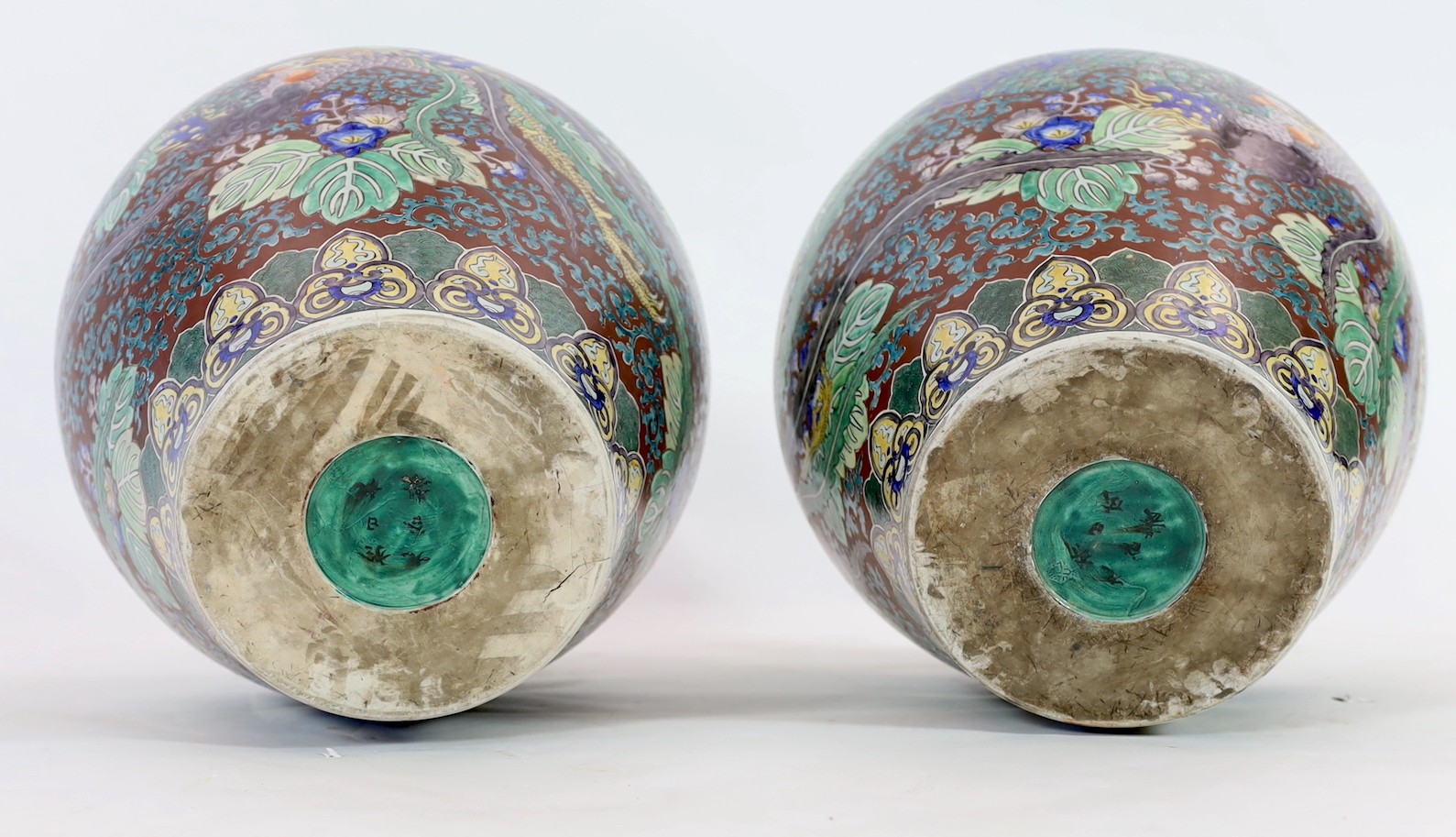 A pair of massive Japanese Kutani porcelain vases, Meiji period, influenced by de Morgan designs, 61.5cm high, one repaired